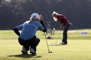Women playing golf