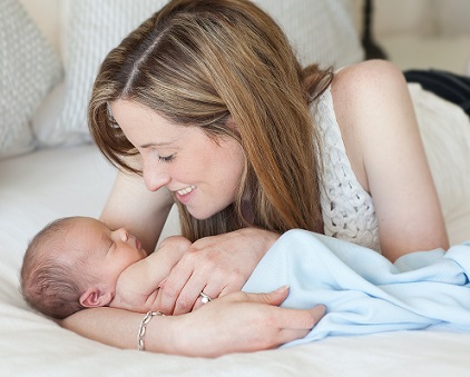 Naomi and Sam Prescott on bed photo
