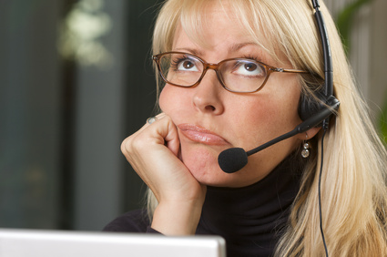 Bored Businesswoman on Telephone Headset