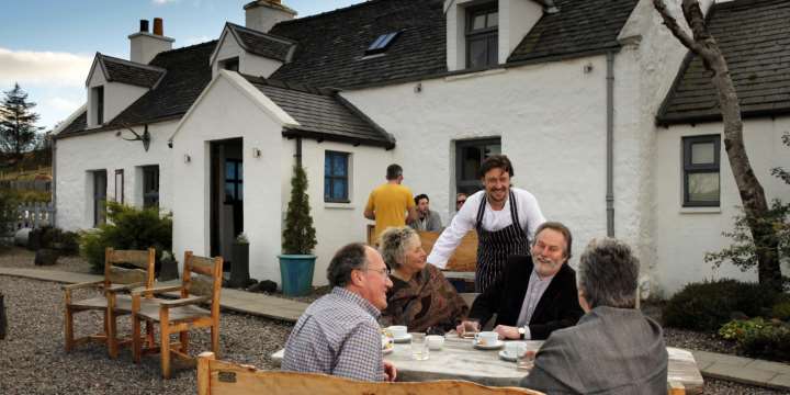Head Chef Michael Smith with guests outside The Three Chimneys Restaurant. Source: VisitScotland