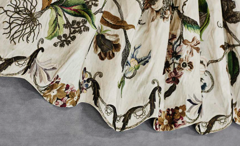 ENGLAND Apron (1730s) silk, silk thread, silver-plated brass thread, cardboard filling 43.2 (centre front) 24.0 cm (waist flat) Purchased, 1970