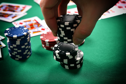 dealer collects poker chips