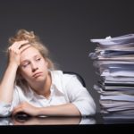 Photo of burnout office worker lying on desk