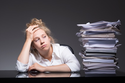 Photo of burnout office worker lying on desk