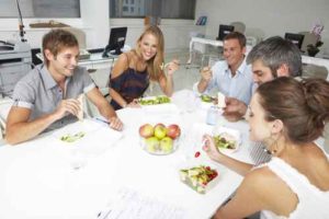 Young coworkers having lunch