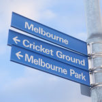 Street sign in Melbourne indicating direction to the cricket ground